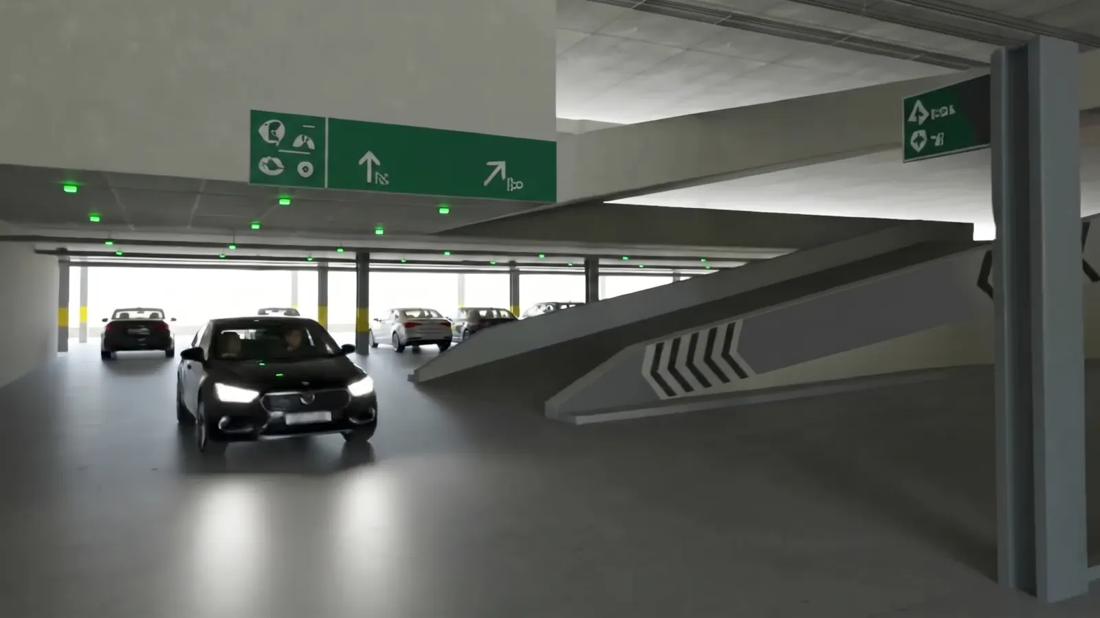 The parking deck — green guidance lights above open bays, a chevron-marked ramp beyond